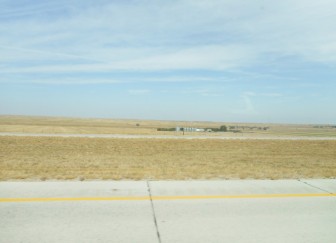 A lot of isolated buildings are visible from the road.